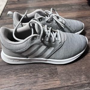 Woman’s Adidas cloudfoam sneakers.